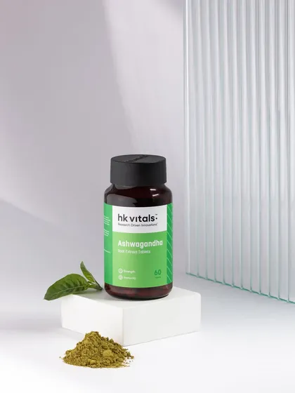 This is our signature minimalist aesthetic. We used clean lines, soft shadows from a fluted glass prop, and a simple composition to highlight the natural essence of this Ashwagandha supplement, creating a feeling of calm and purity.