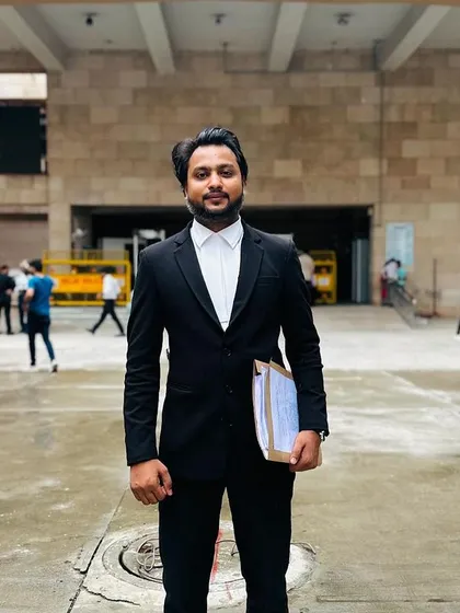 Holding a case file outside the Rohini District Court. This is part of my daily groundwork, ensuring all documents are in order before a hearing.