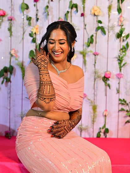 The lovely Shilpa, looking radiant and happy during her sangeet ceremony, her hands adorned with my designs.
