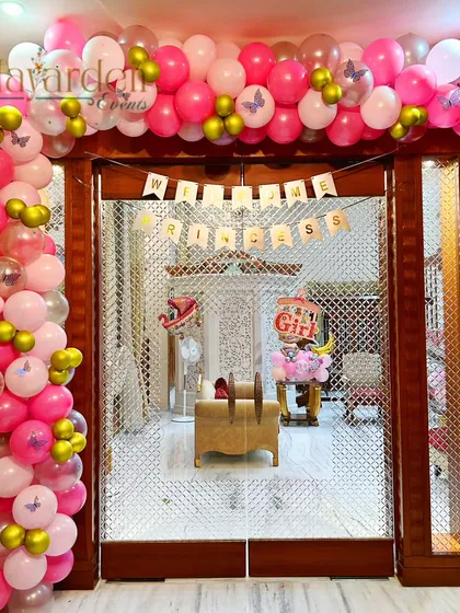 A 'Welcome Princess' balloon arch at the entrance of a home. This is a wonderful way to greet the new baby girl and mom.
