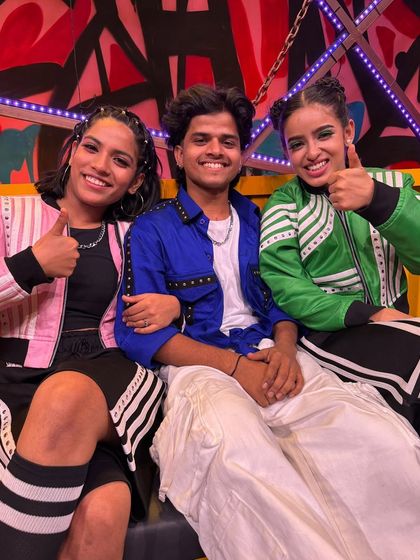 Thumbs up and ready to go. This photo captures the excitement and anticipation we felt before hitting the stage.