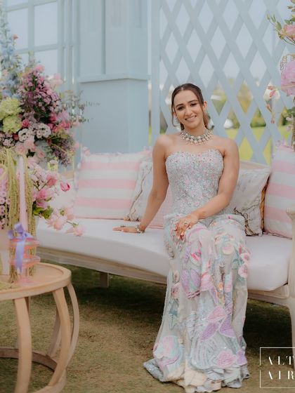 The beautiful bride at her 'Mayfair Luncheon', perfectly complementing the pastel palette and dreamy floral corners. The entire design was imagined for her gentle, gracious, and warm personality.