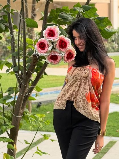 Admiring a freshly made bouquet of crochet roses. Each one is a small piece of art, crafted with care and attention to detail.