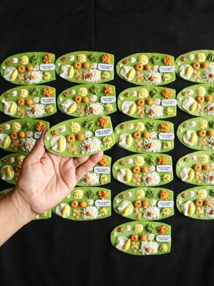 A large batch of personalized South Indian meal magnets, created as unique wedding favors.