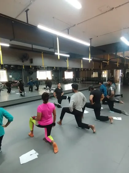 Students practice lunges together, learning about proper form, depth, and balance. Group practice helps build confidence and allows for peer observation and correction.