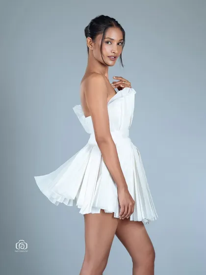 A side view of the paper dress, highlighting its interesting silhouette. This shot is a great example of my creative and conceptual studio work.