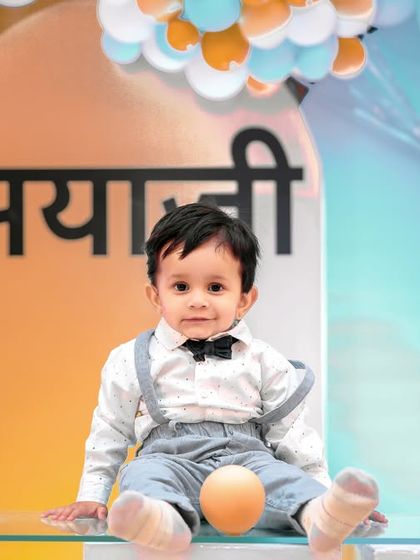 A playful 'Mickey Mouse' themed birthday party, with bright colors, character cutouts, and a fun balloon arch, creating a joyful atmosphere for little ones.