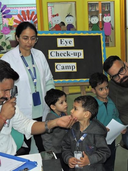 A team of healthcare professionals works together to conduct the eye check-ups, ensuring every child receives attentive and expert care.