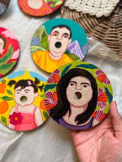 A closer look at the personalized family coasters. We love capturing the unique expressions and personalities of each family member in our vibrant, illustrative style.
