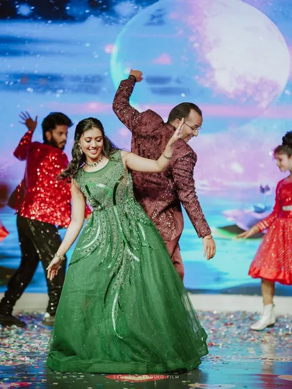 Lost in the rhythm of their love during a spectacular Sangeet performance. The energy, the lights, and the shared joy on the dance floor make for an unforgettable cinematic wedding film moment.