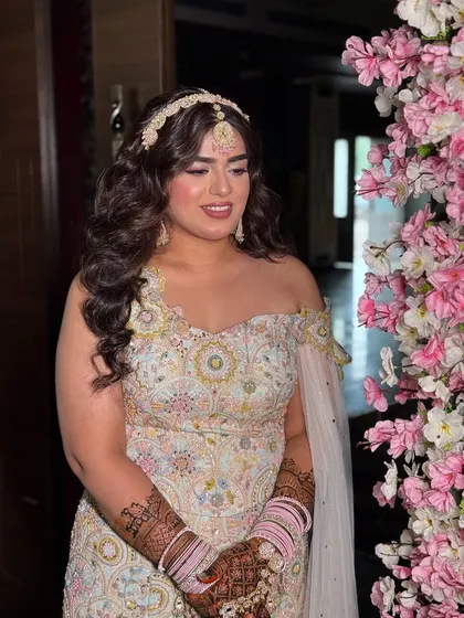 Nam’s Mehendi look was nothing short of a fairytale. With her dreamy outfit and butterfly wings, we created a princess-like look with soft, glowing makeup and beautiful curls.