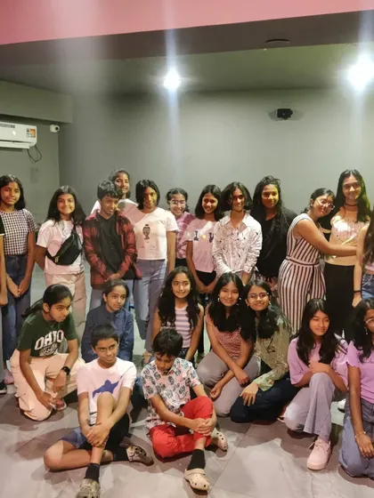 A large group of kids posing for a photo.