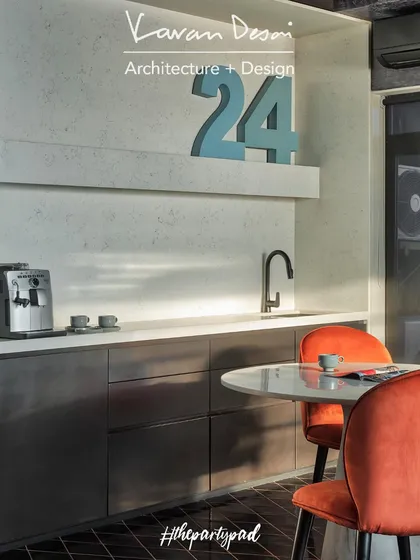 The pantry area is both functional and stylish, with a Kalinga stone counter and plenty of storage. The large "24" adds a personal, graphic element to the space.