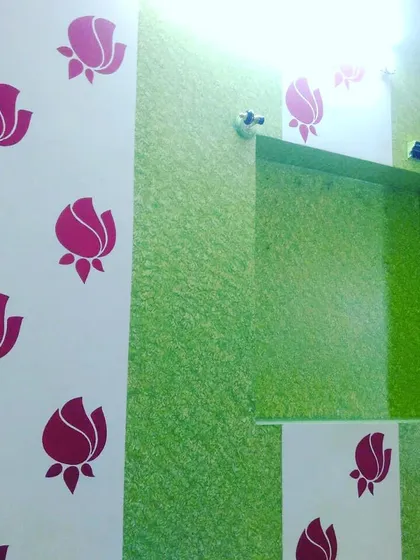 Here, we combined a fresh green textured finish with a simple rose stencil pattern. This is a great example of how different decorative techniques can be layered for a unique, custom look.