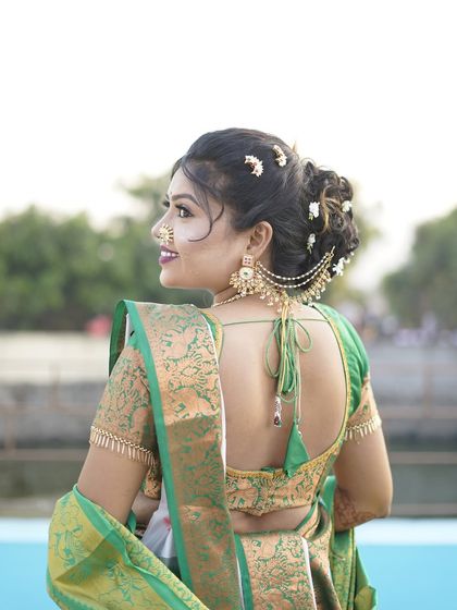 Another angle of the beautiful bridal hairstyle, showing the placement of the flowers and the 'ambada' pin.