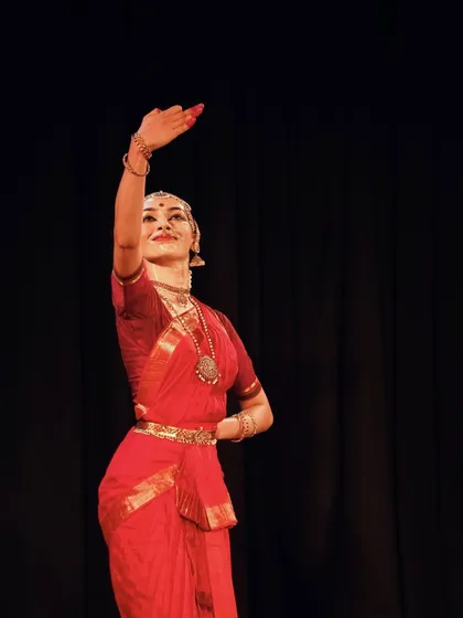 A graceful pose from the HCL concert, with arms extended in a gesture of offering. Dance, for me, is an offering to the divine and to the audience.