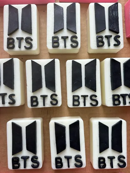 BTS-themed soaps for the ultimate K-Pop fan, featuring the band's iconic logo in black and white.