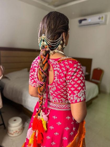 The full view of the vibrant and playful braid, a perfect hairstyle for a daytime wedding celebration.