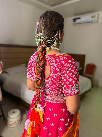 The full view of the vibrant and playful braid, a perfect hairstyle for a daytime wedding celebration.