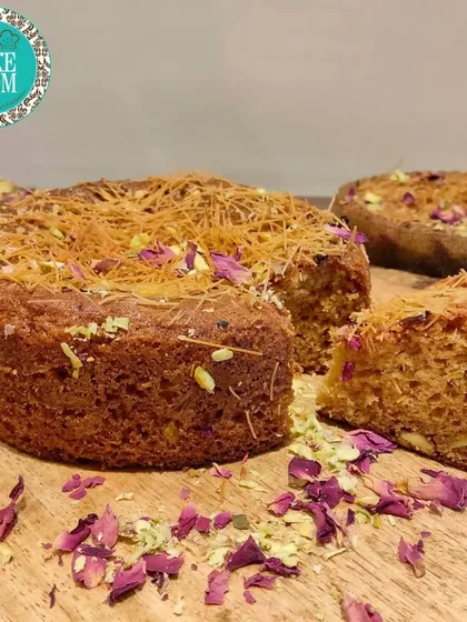 Our Rose Pistachio Kunafa tea time cake. This cake combines the delicate flavors of rose and pistachio with the unique texture of crispy kunafa pastry for a Middle Eastern-inspired treat.