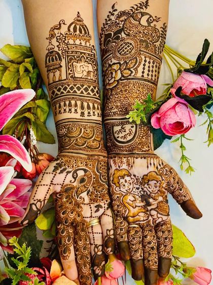 An intricate and personalized Rakhi design. One hand features a brother-sister portrait, while the other is adorned with a majestic peacock, blending personal touches with traditional art.