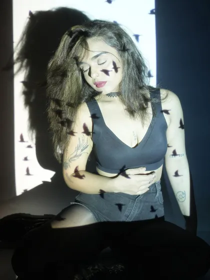 A dreamy, artistic portrait with a projection of birds. This image is a literal and figurative representation of my persona, 'Bird', and my connection to my 'birdlings'.