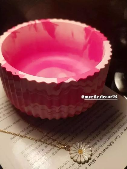 A close-up showing the inside of the pink marbled jar. The smooth, polished interior contrasts beautifully with the textured exterior.