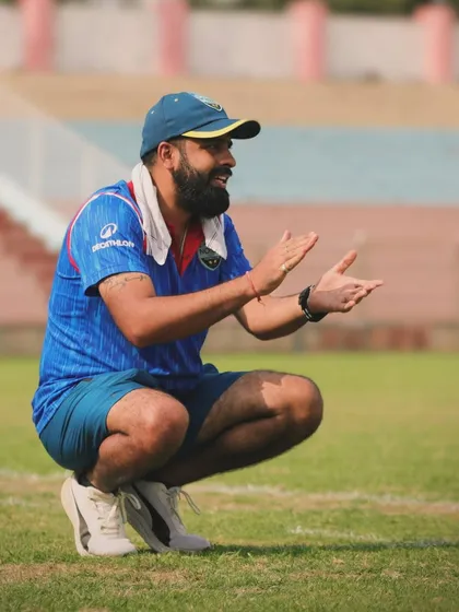 Our head coach on the training ground, passionately guiding the team. His energy and dedication are infectious.