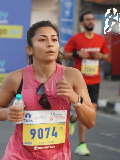 Pushing through the miles at the Tata Mumbai Marathon. Staying hydrated and maintaining focus is a key part of my race strategy, and something I emphasize with all my runners.