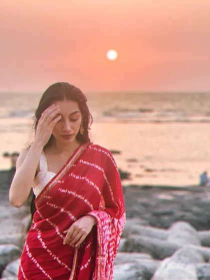 A quiet moment by the sea during sunset. Beach locations offer beautiful natural light and a relaxed atmosphere for lifestyle, wellness, and resort wear campaigns.