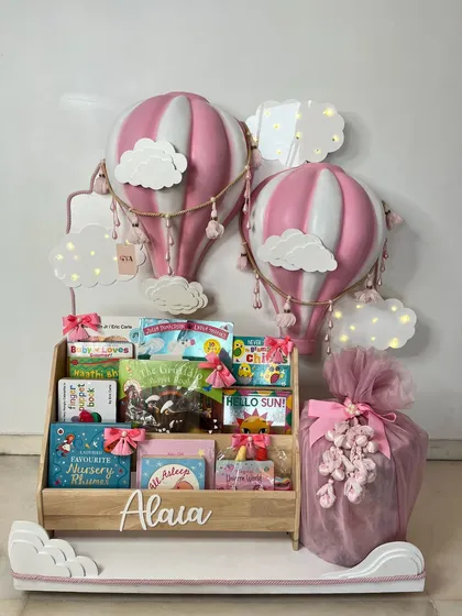 The complete hot air balloon gift set, a perfect addition to a nursery, combining a functional bookshelf with a beautiful, imaginative decorative piece.