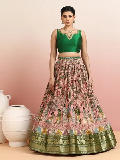 Another angle of the green blouse and printed skirt, showcasing the beautiful color combination and the golden zari border.