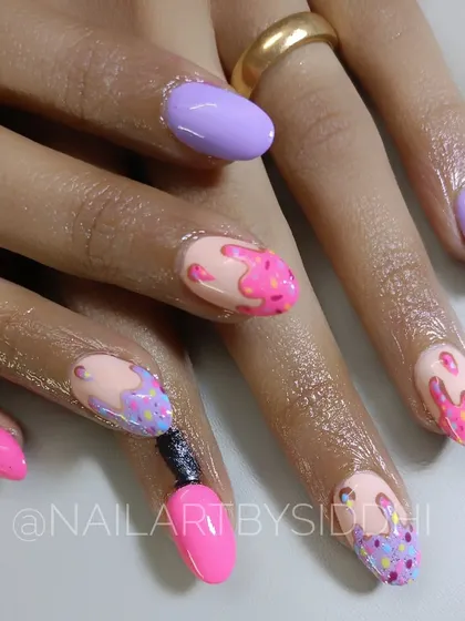 A fun and playful set of nails inspired by melting ice cream. I used bright pastel colors and 3D sprinkle details to create a whimsical look, with one nail even designed to look like a tiny nail polish bottle.