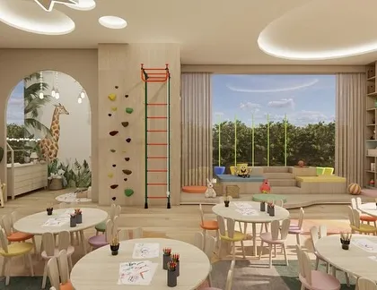 Children's playroom with a climbing wall and large window.