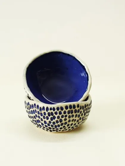 The organic, slightly uneven rim of the Aqua Snack Bowls is a signature of their hand-built nature. They are perfectly imperfect and full of character.