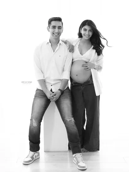 A relaxed and happy couple's portrait in black and white. Removing the color puts the focus entirely on their joyful expressions and easy connection.