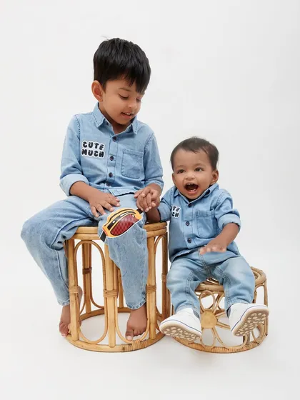 Sibling photos are so special. This shot captures the sweet connection between an older brother and his baby sibling. I use simple props like these rattan stools to add a touch of warmth without distracting from the moment.