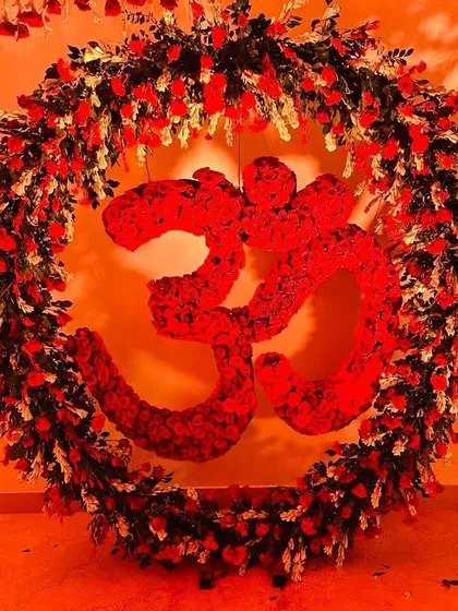 The 'Om' symbol is central to so many spiritual events, and I love creating it with fresh flowers. This piece, made from hundreds of red roses for a Mata ki Chowki, becomes a powerful focal point for devotion and prayer, filling the space with vibrant, positive energy.