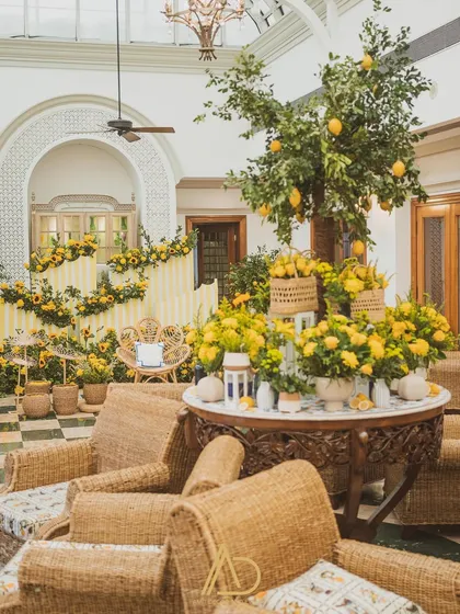A wider view of the lemon and sunflower themed Haldi decor, showing the cozy seating areas and the bright, cheerful atmosphere I created indoors.