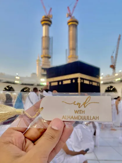 A simple yet meaningful resin bookmark with the phrase "Start with Bismillah" or "End with Alhamdulillah". Photographed at the Kaaba, it’s a small reminder of faith to accompany your reading.