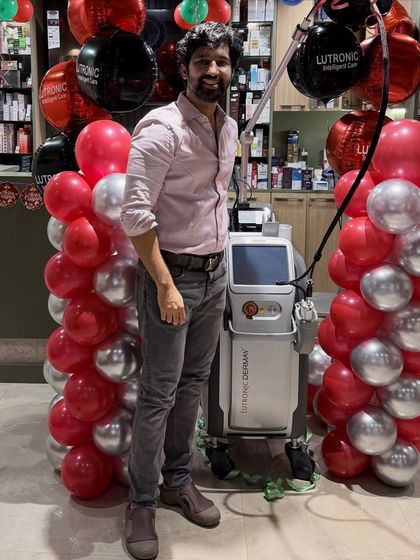 Posing with the new Derma V laser at my clinic. Investing in the latest global dermatology technology is a core part of my commitment to providing my patients with nothing but the best, most effective treatments available.