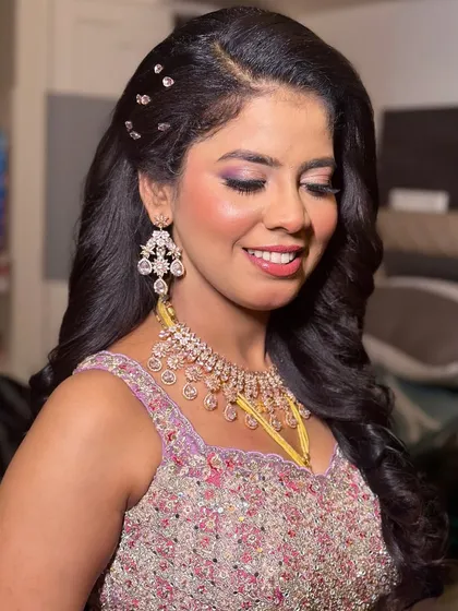 This is a beautiful example of a modern reception look. I created a soft glam eye with a hint of shimmer and a glowing complexion, paired with diamond jewellery for a sophisticated and elegant finish.