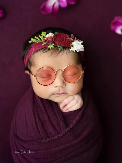 Adding a little fun to this plum-colored setup with a pair of cool, round glasses. It's a simple way to add a touch of personality.