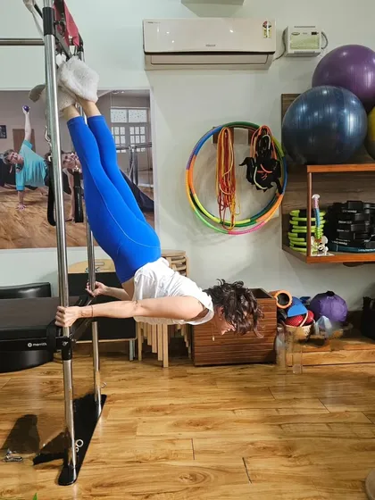 The world still looks amazing upside down! This is me on the Ped-o-Pull, an attachment for the Cadillac, working on inversion, strength, and balance.