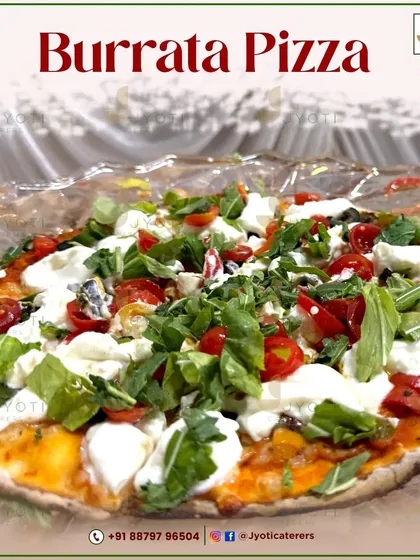 An indulgent Burrata Pizza. The creamy burrata cheese melts over a classic tomato base, topped with fresh arugula for a perfect balance of flavours.