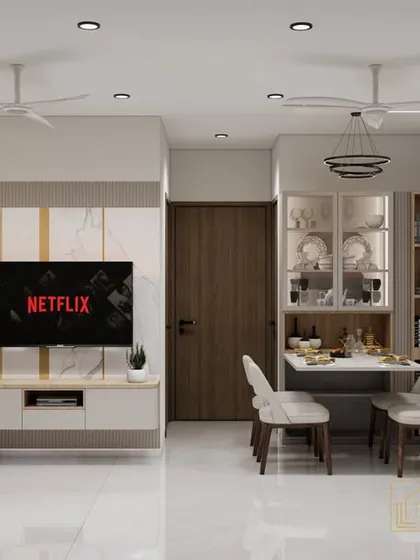 This is a compact living and dining area designed for a modern apartment. We used a light color palette, reflective surfaces, and clever furniture placement to make the space feel bright and spacious.
