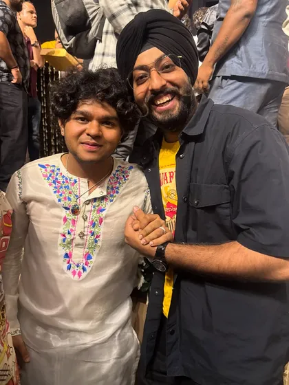 A happy moment with a fellow artist at the Divine Music Festival. The Indian music scene is a vibrant family, and I'm grateful to be a part of it.