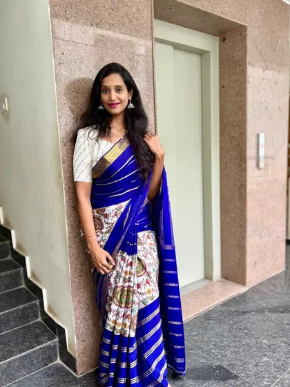 A happy client looking lovely in her pure Mysore crepe digital print saree. The blue and white combination is so fresh and elegant.