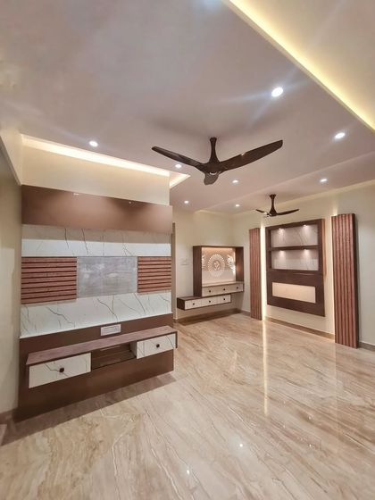 This living room was designed with an earthy and minimalistic theme on a medium budget. The Italian marble flooring is the center of attraction.
