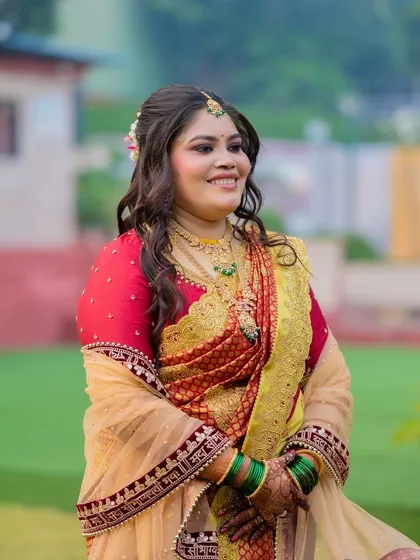 A joyful bride in a beautiful outdoor setting. The makeup is designed to look stunning in natural light.
